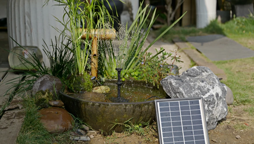 Garden fountain scenario for a solar water fountain kit