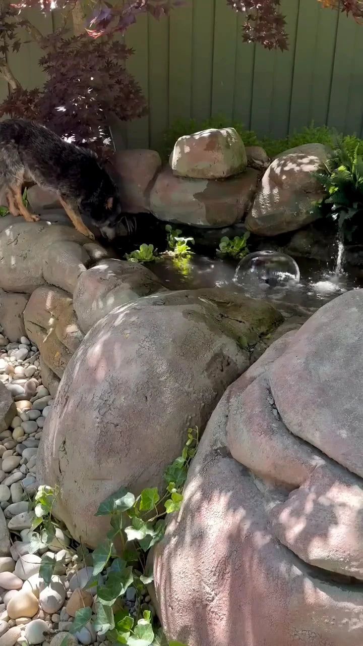 Water cascading past rocks in the finished garden scene